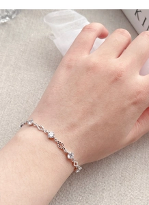 Detailed view of S925 sterling silver bracelet with diamond-shaped links and zircons