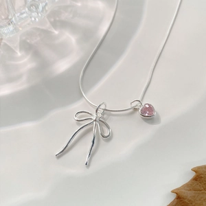 Exquisite S925 silver necklace with a pink heart pendant and minimalist metal bow detail