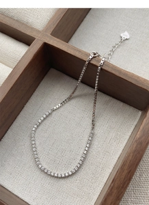 Detail of S925 sterling silver bracelet with pavé diamonds and square box chain