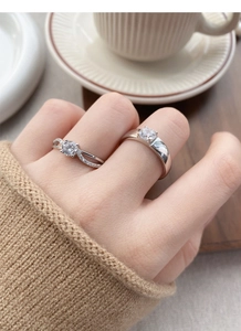Detailed close-up of S925 sterling silver couple rings with sparkling zircon inlay
