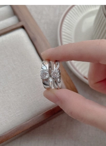 Detailed macro view of S925 sterling silver couple rings with sparkling zircon stones
