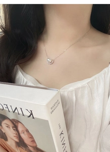 Elegant S925 sterling silver necklace with pearl and zircon pendant on a model