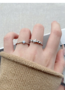 Detailed close-up of S925 sterling silver butterfly rings with sparkling zircon accents