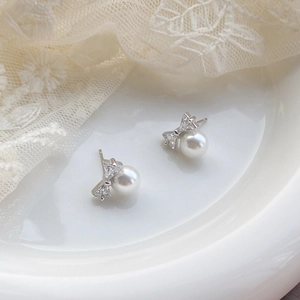 Elegant S925 silver bow stud earrings with sparkling zircon and round white pearls
