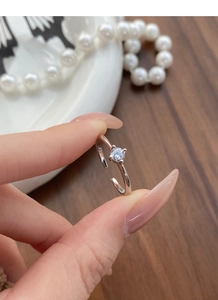 Detail of S925 sterling silver stamp on adjustable ring with zircon stone