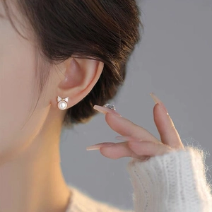 Elegant S925 silver bow stud earrings with white pearls and sparkling zircons for women