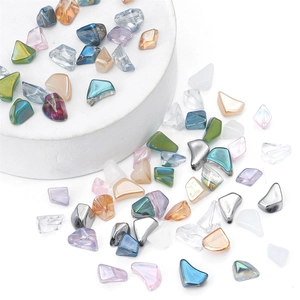 Macro shot of 7-12mm irregular glass beads in aurora and frosted finishes for DIY jewelry