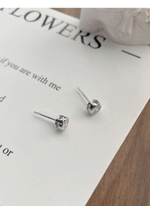 Macro view of S925 sterling silver stud earring with clear zircon and hallmark detail