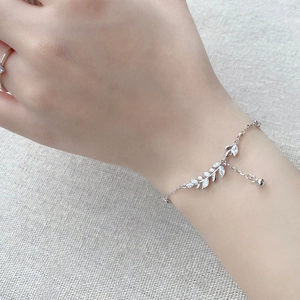 Elegant S925 sterling silver wheat ear bracelet with cubic zirconia on a female wrist