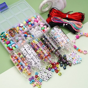 DIY handmade jewelry kit with colorful beads, letter charms, and elastic strings in a grid box