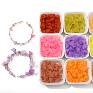 Macro detail of frosted acrylic calla lily beads in various colors for DIY jewelry making