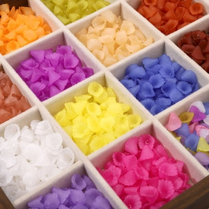 Colorful frosted acrylic calla lily beads in a wooden jewelry box for DIY crafts