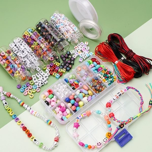 DIY jewelry making kit with colorful beads, alphabet charms, and strings in a storage box