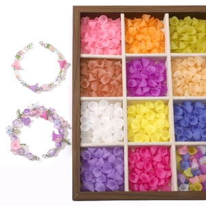 Macro view of frosted acrylic calla lily beads in 12-color wood organizer box