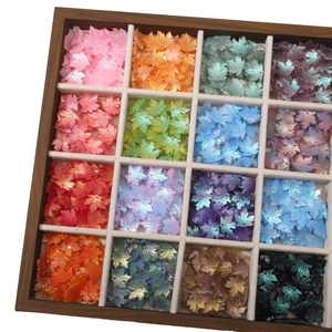 Detailed collection of 16-color glass maple leaf beads in a wooden compartment box for DIY jewelry