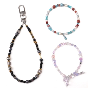 Mix of colorful glass seed bead jewelry featuring handmade bracelets and a lanyard