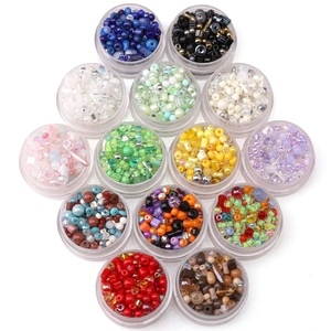 Colorful assorted glass seed beads set in 12 plastic storage jars for DIY jewelry making