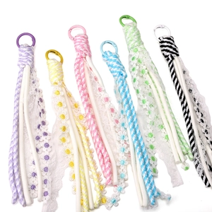 Handmade daisy lace pendants with polyester tassels and woven ropes in six vibrant colors