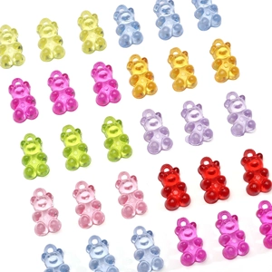 Close-up of colorful translucent acrylic bear pendants for DIY jewelry making