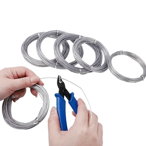 Silver plastic coated aluminum wire roll for jewelry making with blue cutting pliers tool