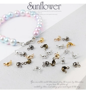 Multi-color DIY jewelry clasp connectors shown with a gradient pearl bracelet on a white surface
