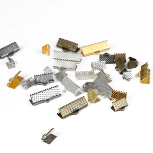 Assorted iron ribbon crimp ends in gold, silver, and bronze finishes for DIY jewelry making