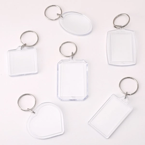 Close-up of clear acrylic DIY keychains in heart, square, and rectangle shapes