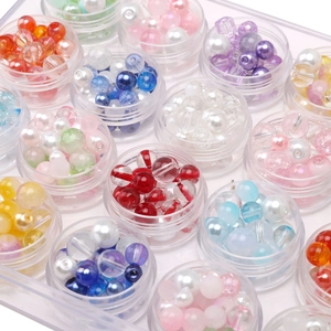 Colorful assorted glass seed beads set in 12 round clear jars for DIY jewelry making