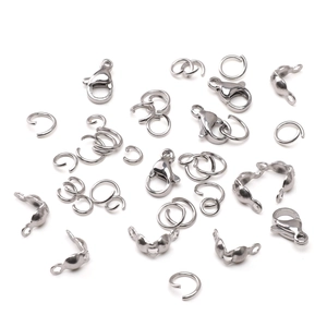 Polished stainless steel jewelry findings including lobster clasps and jump rings
