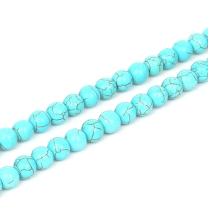 Macro shot of 4mm synthetic turquoise round beads with brown matrix patterns for DIY jewelry