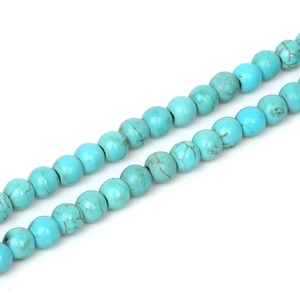 Macro shot of 10mm round blue turquoise beads with natural brown matrix for DIY jewelry