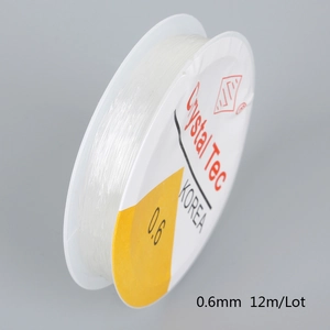 Detailed view of 0.6mm transparent elastic beaded string on a 12m Crystal Tec spool