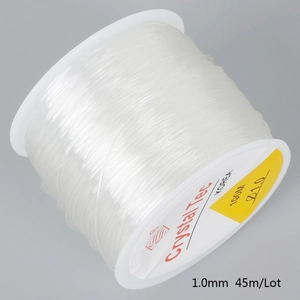 Detail of 1.0mm Crystal Tec transparent elastic beading cord on a white spool for jewelry
