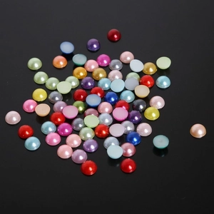 Flat-back multi-color resin pearls for nail art and DIY handicrafts on black background