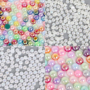 Macro view of multi-color aurora ABS half-round flatback pearls for DIY jewelry and nail art