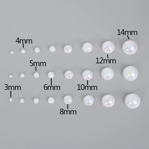 Matrix display of multi-size white iridescent ABS half pearls for DIY crafts and jewelry