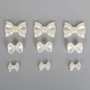 Cuentas de ABS blanco perla en forma de lazo en tres tamaños para joyería DIY y arte de uñas
