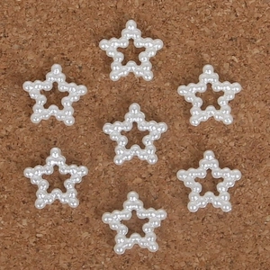Vista plana de apliques de perlas con forma de estrella para decoración de accesorios de pelo