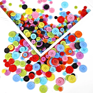 Assorted colorful plastic buttons with four holes for DIY crafts and shirt sewing