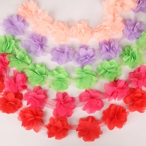 Detailed macro view of 3D chiffon flower lace ribbon in five vibrant assorted colors