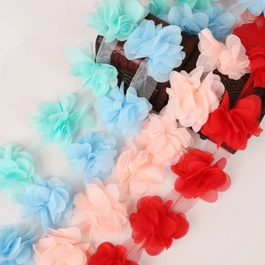 Detailed view of layered 3D chiffon flower lace trim in multiple vibrant colors