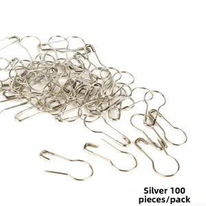 Detalle de 100 imperdibles plateados para manualidades y etiquetas de ropa