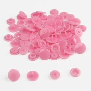 Detailed view of pink T5 resin snap fasteners components on a clean white background
