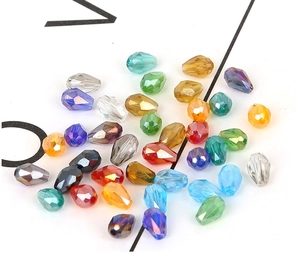 Macro shot of 4x6mm faceted teardrop glass beads with iridescent crystal finishes