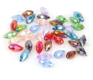 Close-up of colorful faceted teardrop glass beads for DIY jewelry making accessories