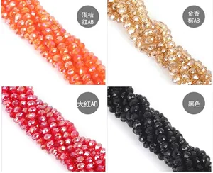 Macro detail of 8mm faceted crystal beads in red, black, and champagne with AB coating