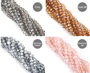 Detail of 8mm faceted glass crystal beads in grey, gold AB, silver, and pink AB finishes