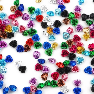 Detailed macro view of colorful 3D rose-shaped aluminum beads with metallic finish for DIY jewelry