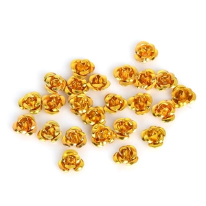 Macro shot of gold aluminum rose beads for DIY jewelry and handicraft decorations