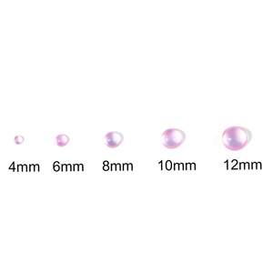 Pink resin faux cat-eye cabochons for DIY jewelry in sizes 4mm to 12mm on white background